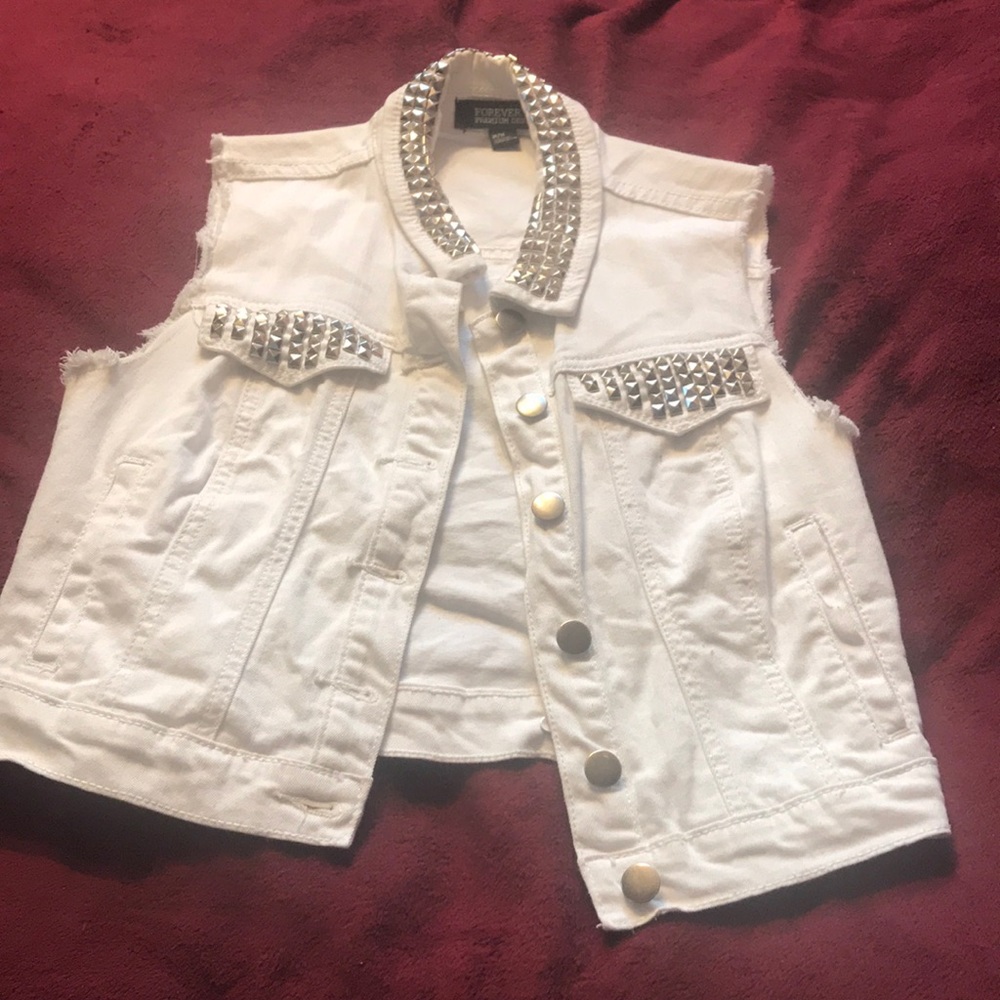 Ripped sleeveless jean jacket